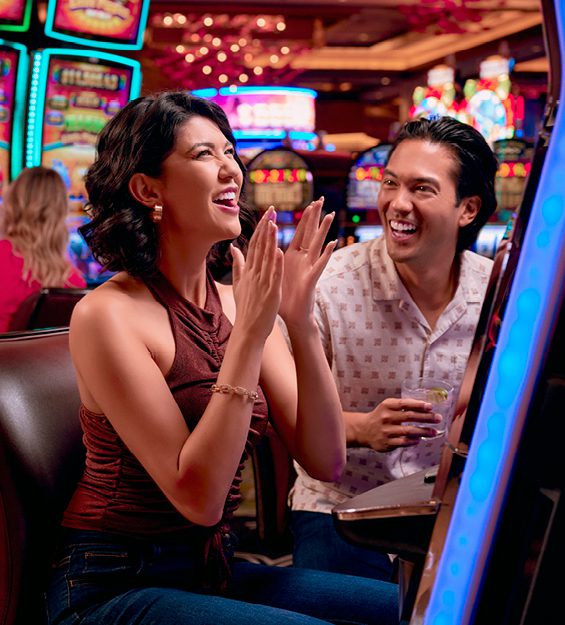 A photo of a couple winning at a slot machine. Vegas Matt will be holding a group pull at Graton Resort & Casino on May 4, 2024.